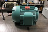 Teal Standard Duty Roto Phase Converter sitting on workbench